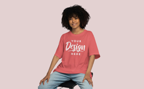 Black young girl sitting t-shirt mockup | Start Editing Online