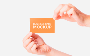 hands holding business card mockup