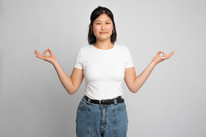 Asian girl doing mudras in t-shirt mockup