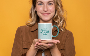 Blonde woman smiling with mug mockup