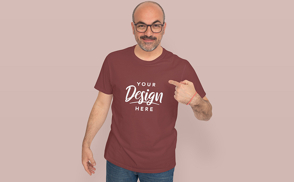 Man in solid background pointing at t-shirt mockup