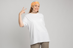 Hispanic woman gesturing with hand in t-shirt mockup
