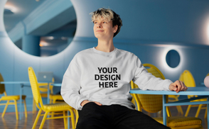 Man sitting in yellow chair sweatshirt mockup