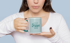 Woman blowing on coffee mug mockup