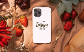 Phone case on blanket with strawberries mockup