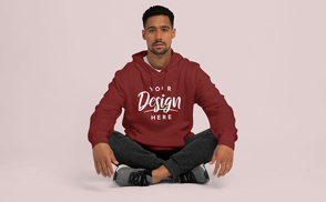 Hispanic man sitting down in hoodie mockup