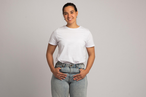 Young hispanic girl in jeans and t-shirt mockup