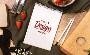 Notebook on picnic with pencils mockup