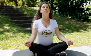 Pregnant woman doing yoga in park t-shirt mockup