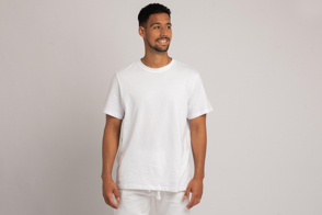 Hispanic male model in white pants and t-shirt mockup