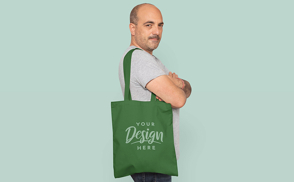Man with crossed arms and tote bag mockup