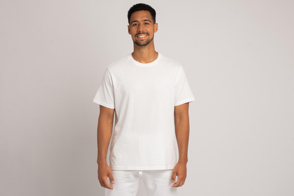 Hispanic young man wearing white pants and t-shirt mockup