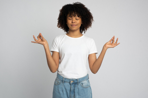 Black woman doing mudras in t-shirt mockup