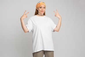 Hispanic girl gesturing with hands in t-shirt mockup