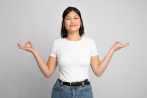 Asian woman doing mudras in t-shirt mockup