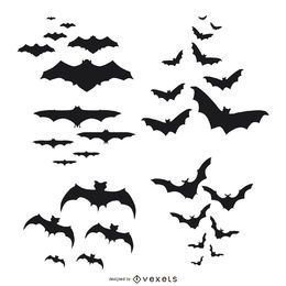 Siluetas de murciélagos volando conjunto