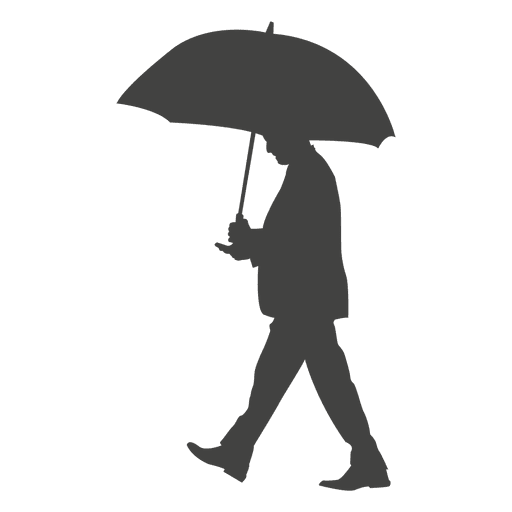 Businessman walking with umbrella