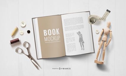 Maqueta de libro abierto de elementos de artesanía