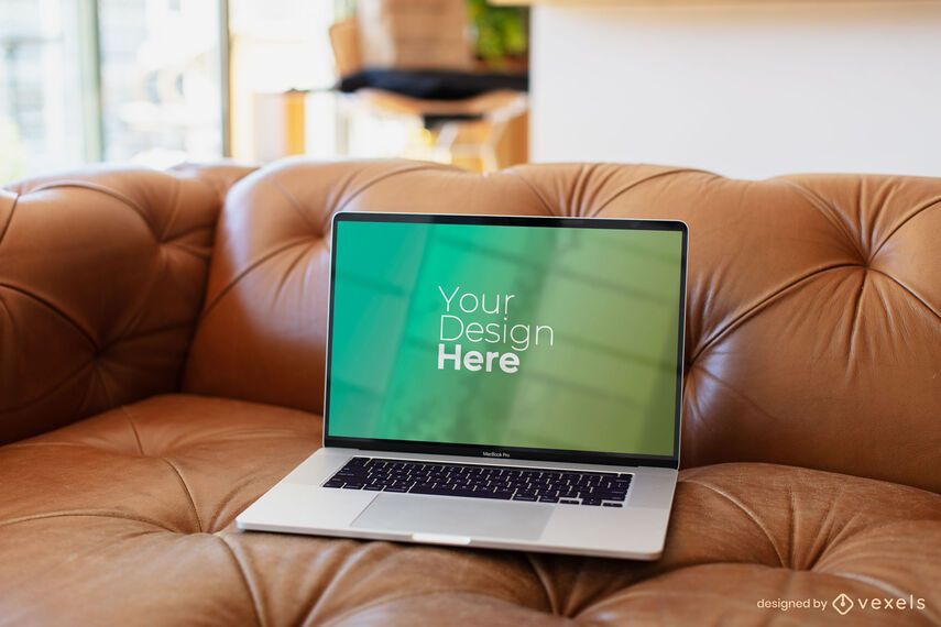 Macbook laptop on brown sofa mockup Macbook laptop on brown sofa mockup