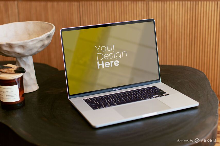 Macbook Pro on dark wooden table mockup Macbook Pro on dark wooden table mockup