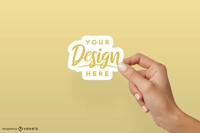 Hand over solid background sticker mockup