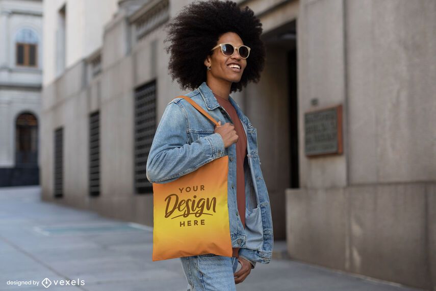 Man in jean jacket street tote bag mockup Man in jean jacket street tote bag mockup