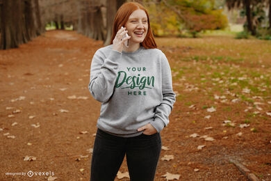 Ginger on phone fall park sweatshirt mockup