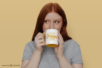 Redhead girl drinking from mug psd mockup