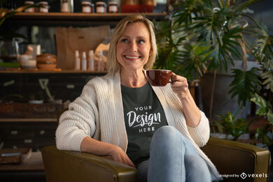 Woman in black t-shirt drinking coffee mockup