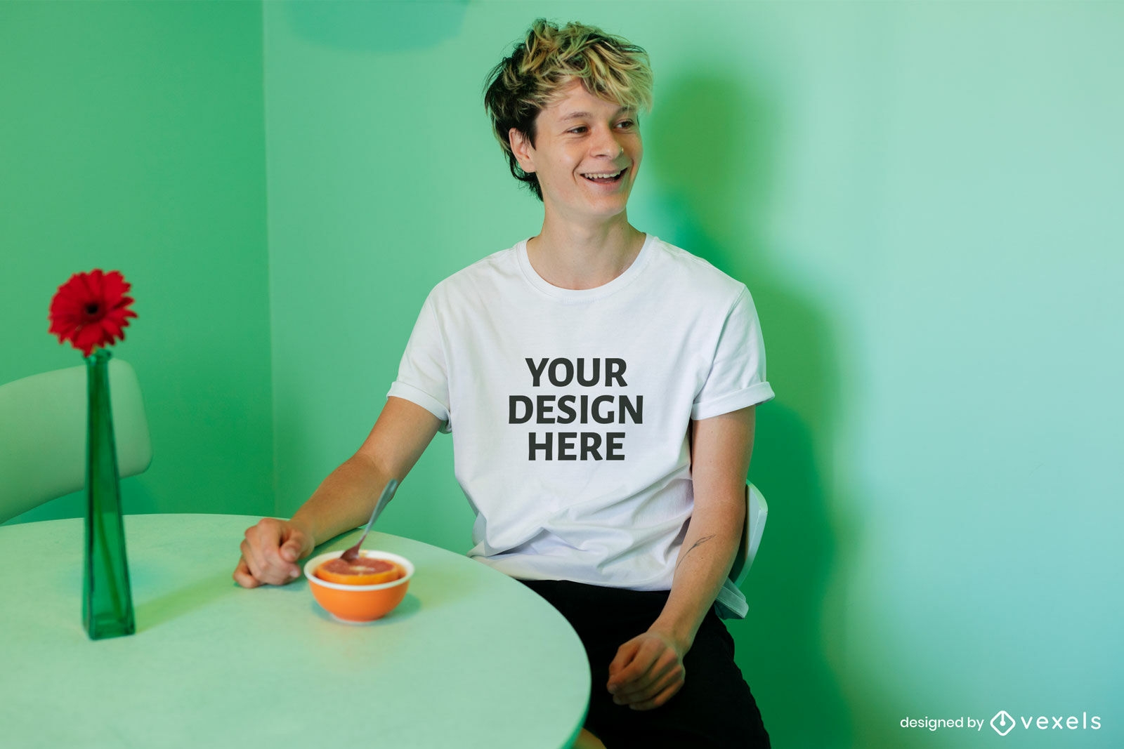 Blonde man in green dining room t-shirt mockup