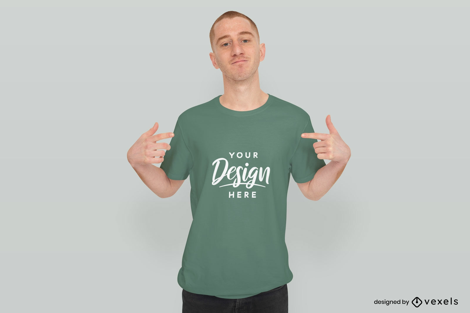 Man in solid background pointing at t-shirt mockup
