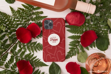 Maquete de capa de telefone com pétalas de rosa e bebida de champanhe