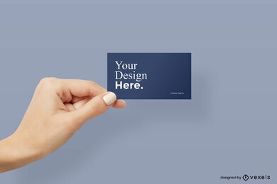 Left hand holding corner of business card mockup