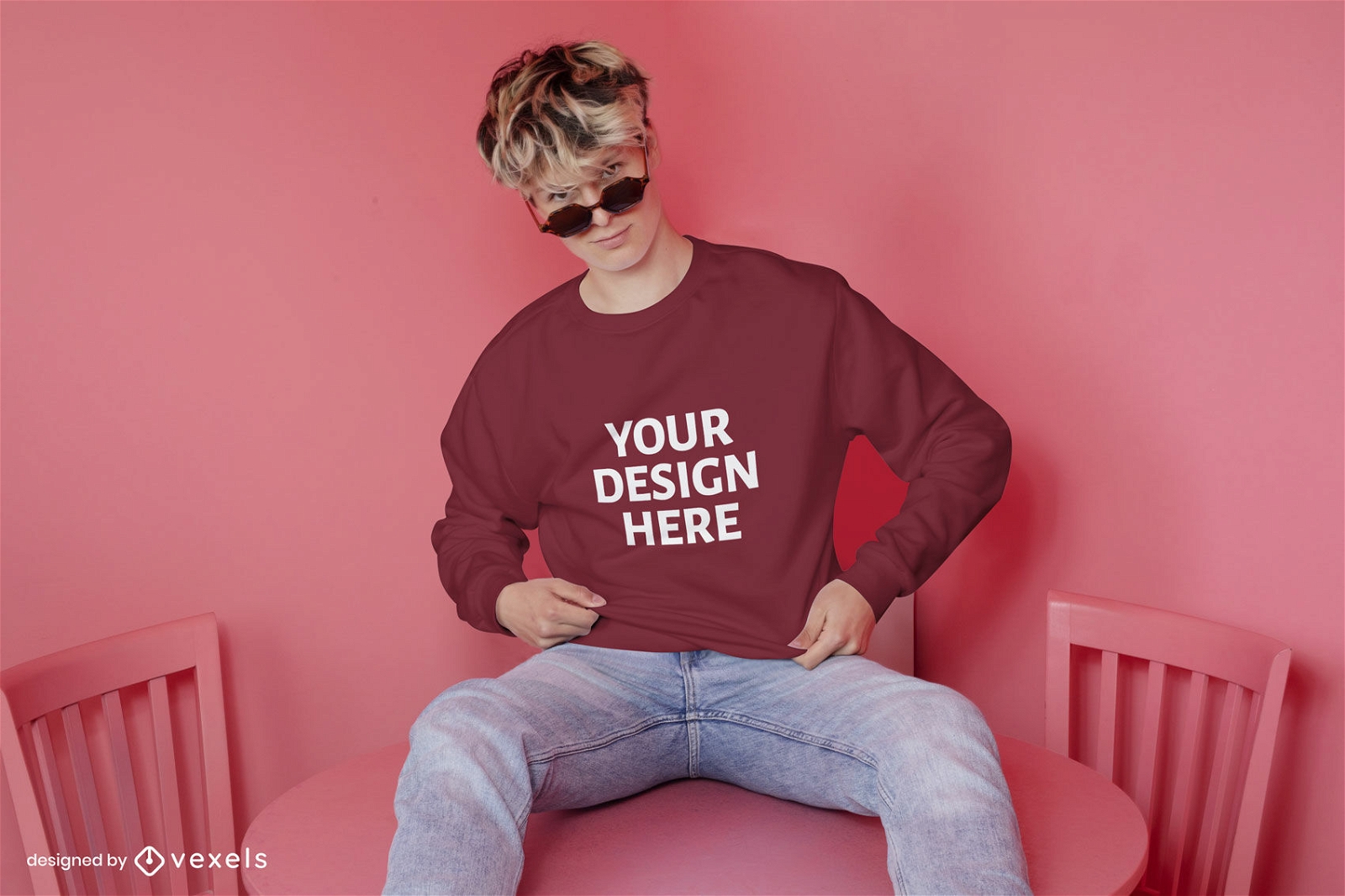 Male model pink table sweatshirt mockup