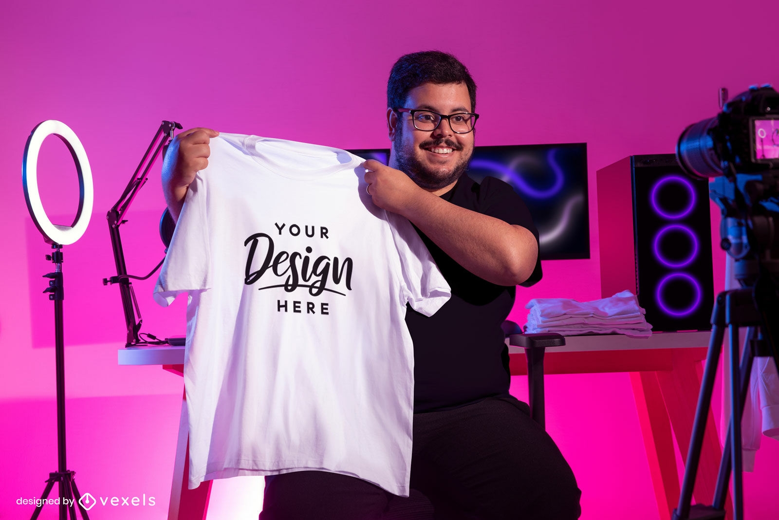 Gamer male model holding t-shirt mockup