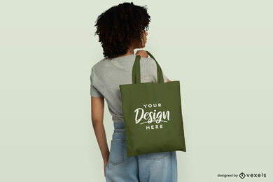 Chica negra con cabello rizado y maqueta de bolso de mano