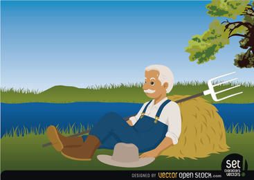 Granjero descansando junto a un lago