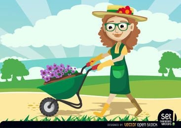 Jardinero mujeres llevando plantas por carretilla