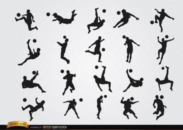 Soccer playersâ hitting ball jumping silhouettes